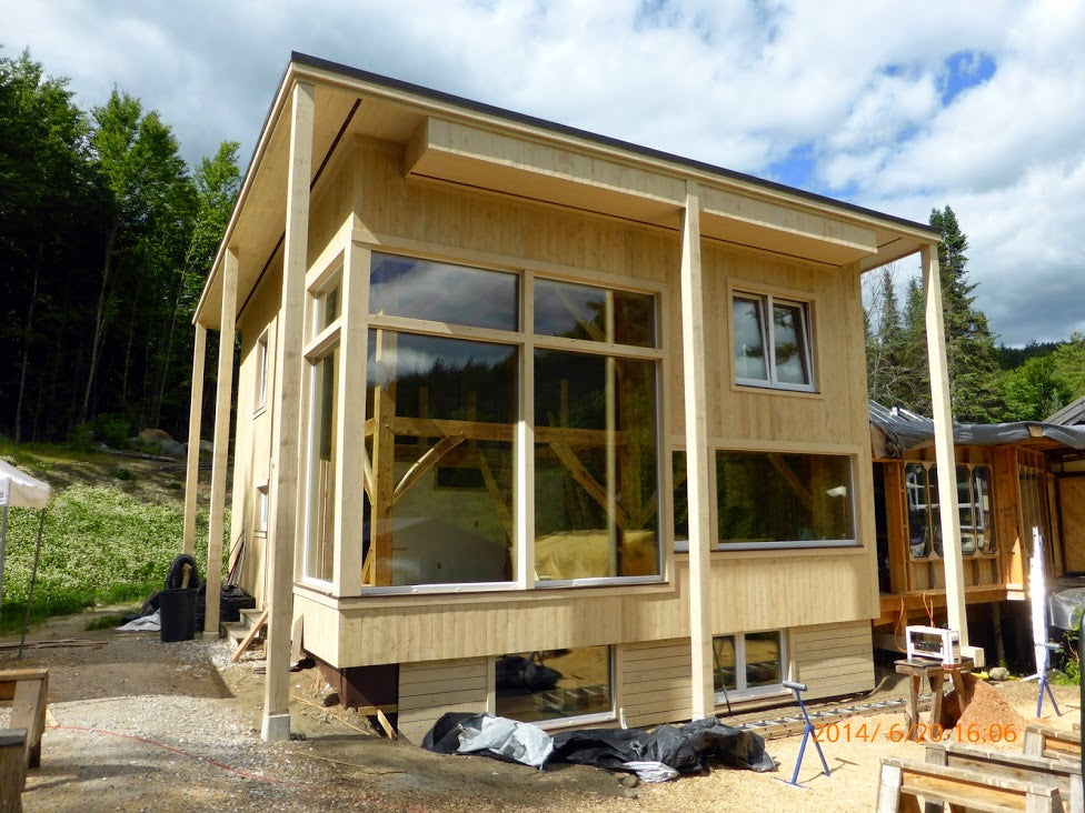 Whitchurch Passive House - with storefront windows show the post&beam structure behind