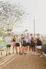 friends having fun playing pickleball together