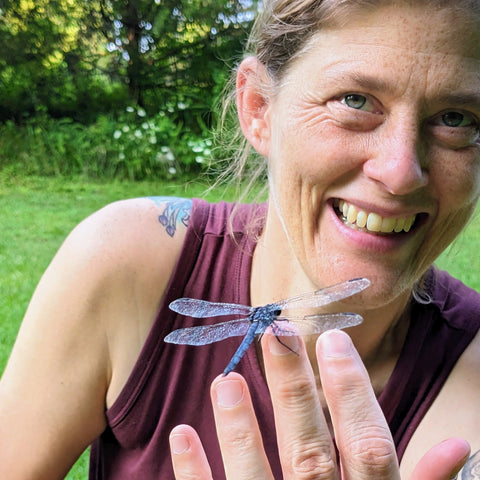 dragonfly on a woman's finger