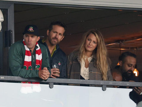 Blake Lively and Ryan Reynolds enjoying a Wrexham soccer game with their kids, showcasing their loving family and strong relationship.