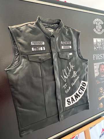 Image of the sold John Teller 'Sons of Anarchy' vest, displaying its high-quality detailing and signature. The vest is set against a clean, white background, accentuating its unique design elements and the authenticity of the autograph