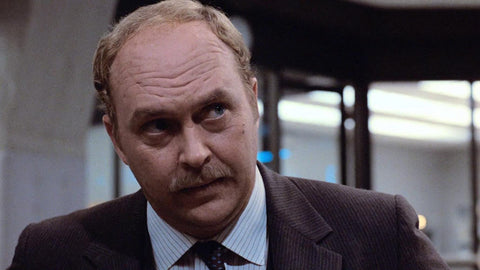 Actor John Ashton in his iconic role as Detective Sergeant John Taggart from the Beverly Hills Cop series. His memorable performance alongside Eddie Murphy and Judge Reinhold helped establish him as a cinema legend