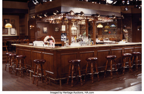 George Wendt and John Ratzenberger, also known as Norm Peterson and Cliff Clavin from the iconic television sitcom 'Cheers', standing in their beloved bar for one last time before it goes up for auction