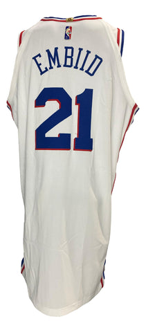 A Philadelphia 76ers on-court style jersey, size XXL, displayed in a frame. This jersey was worn during a game by Joel Embiid against the Utah Jazz on December 9, 2021. The jersey exhibits visible signs of game use. An official Fanatics hologram for authenticity purposes is attached to the jersey