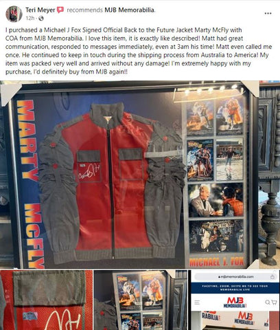 Image of a high-quality replica of the 'Back to the Future' jacket, adorned with Michael J. Fox's signature. The vibrant red and grey jacket, symbolic of the iconic 80s film, is displayed in a protective case, preserving the autograph and the jacket's immaculate condition. A personalized note of gratitude from a delighted customer, Teri, adds a warm, personal touch to the image