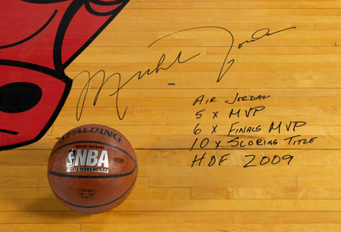 Image showcasing an 8ft x 8ft piece of the historic United Center court from 1994-1998, featuring a massive 2.5 ft signature from Michael Jordan. His significant career achievements are inscribed around the signature, making this piece a monumental artifact of sports history