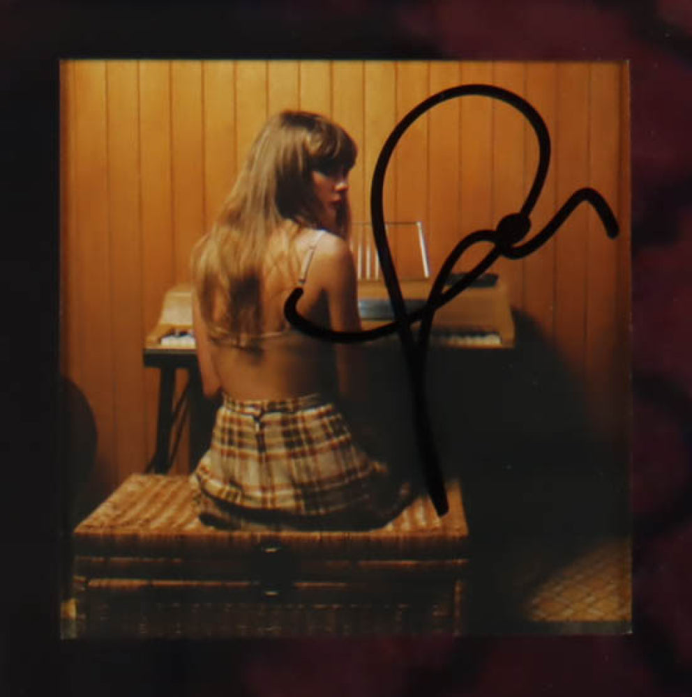 "Image displaying a custom framed collage of Taylor Swift's 'Midnights' album, featuring four CD booklets each signed by Taylor Swift, and four 'Midnights' CDs. A Beckett Authentication Services hologram and LOA are included, verifying the authenticity of the autographs