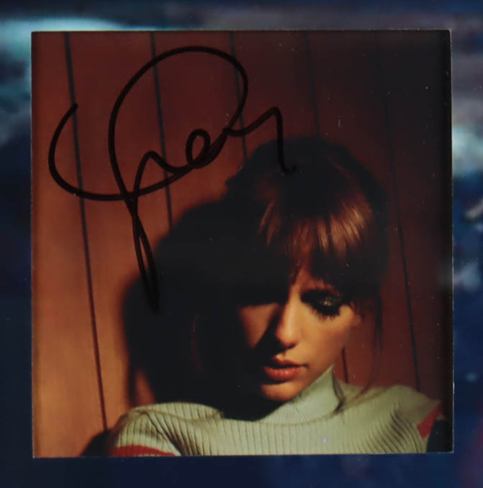 "Image displaying a custom framed collage of Taylor Swift's 'Midnights' album, featuring four CD booklets each signed by Taylor Swift, and four 'Midnights' CDs. A Beckett Authentication Services hologram and LOA are included, verifying the authenticity of the autographs