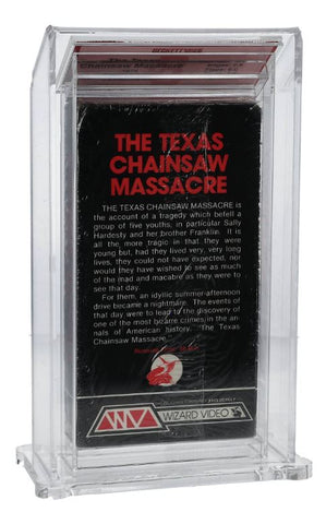A photo showing a factory-sealed "The Texas Chainsaw Massacre" VHS tape from 1980. The packaging artwork features the film's iconic title in bold red letters along with a menacing image of Leatherface, the film's primary antagonist