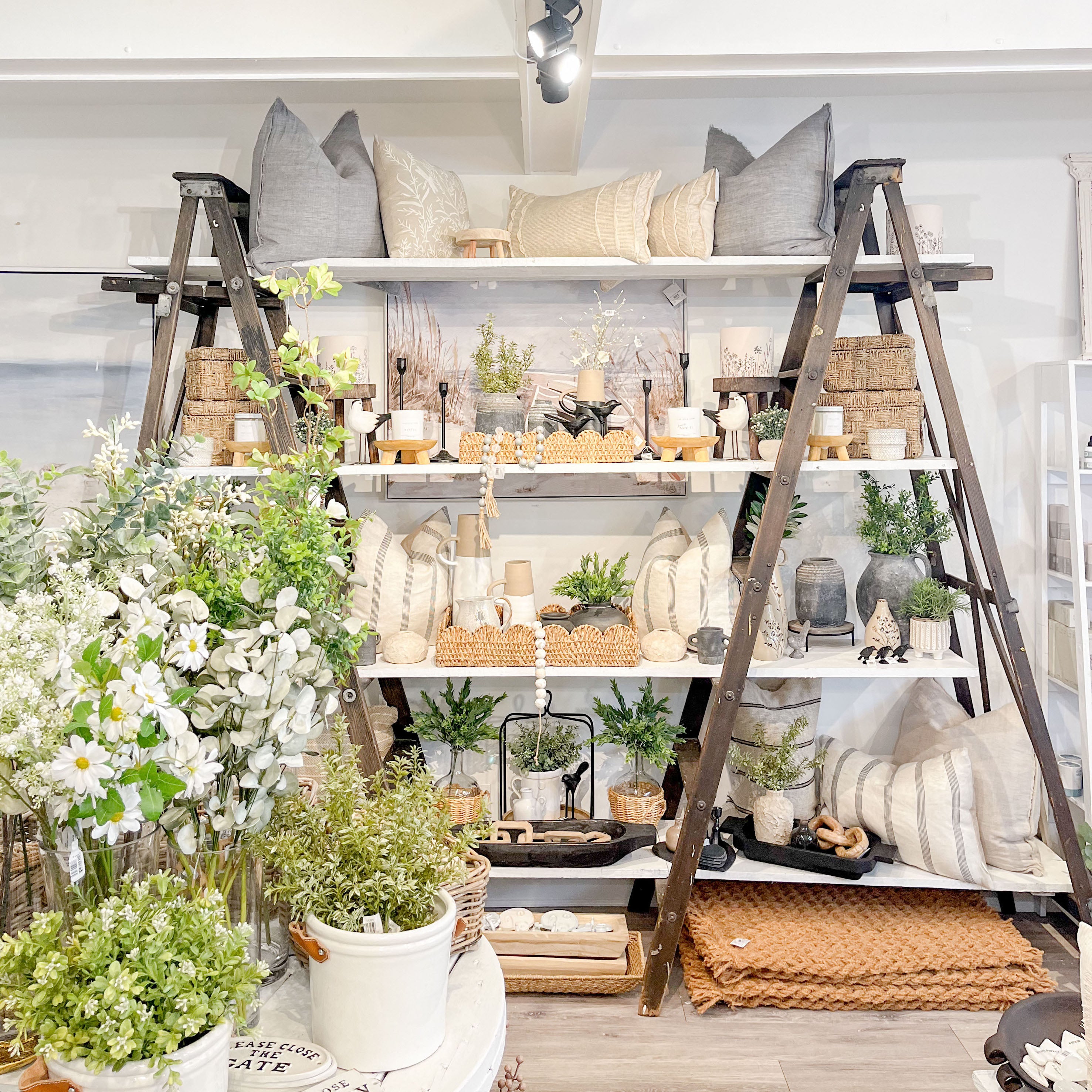 home decor retail display with ladders at Beach Grove Cafe & Boutique