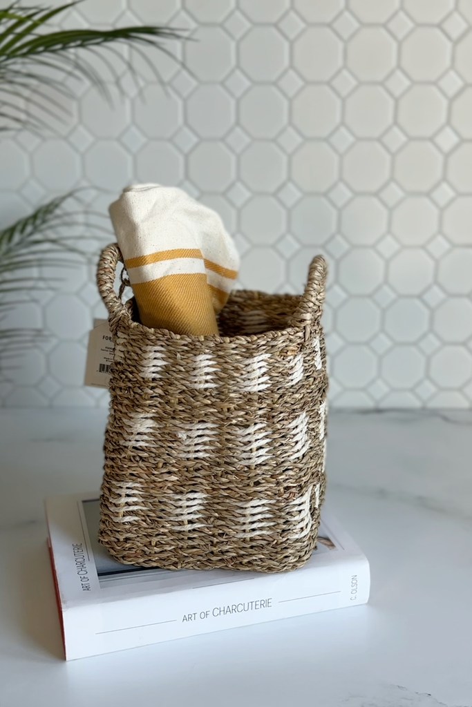 woven basket with striped kitchen towel in kitchen