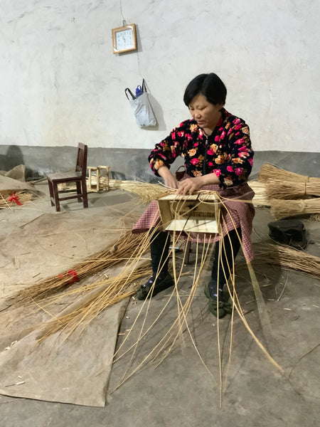 master basket weaver in China weaving a basket