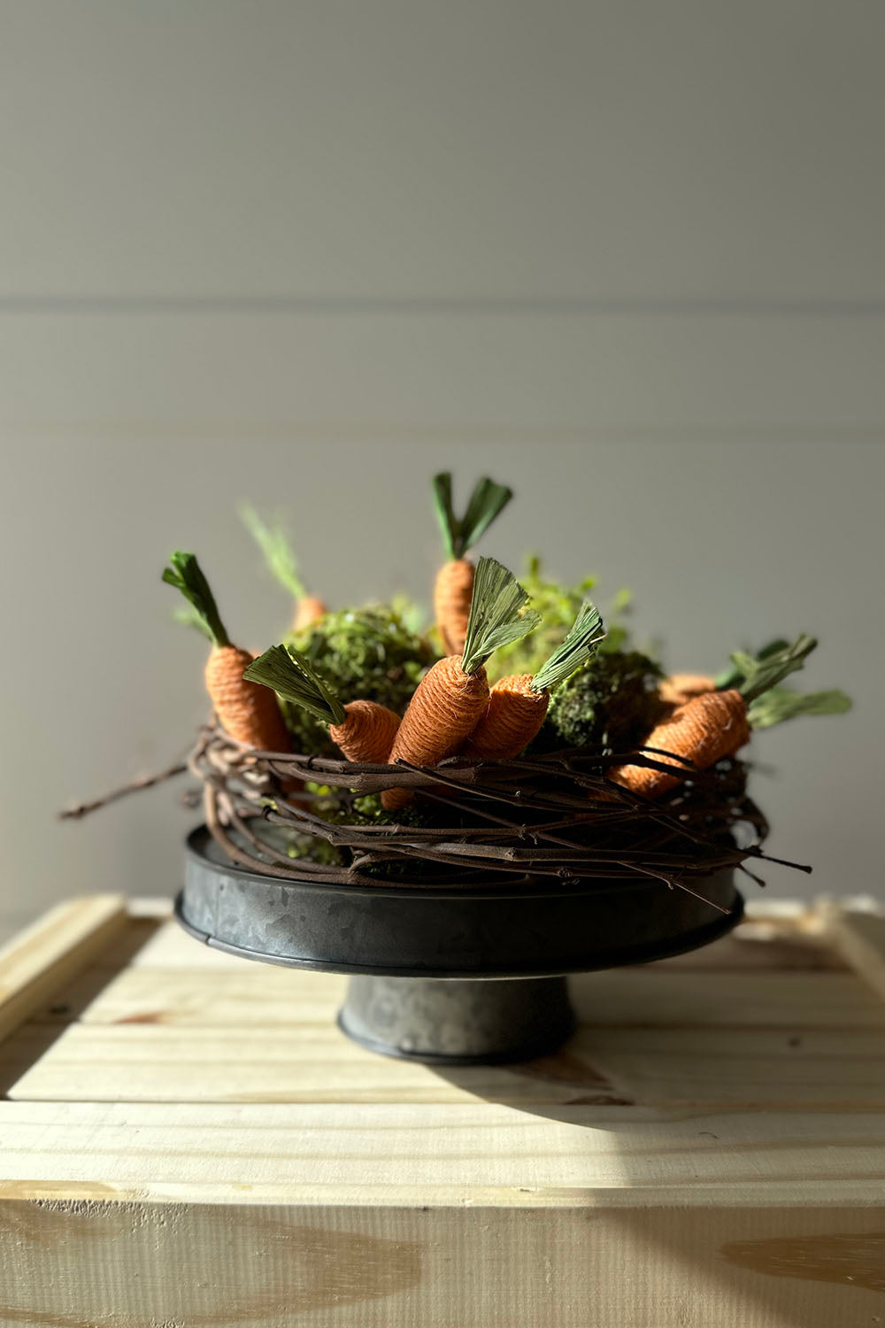 spring lane riser display with moss balls and carrots
