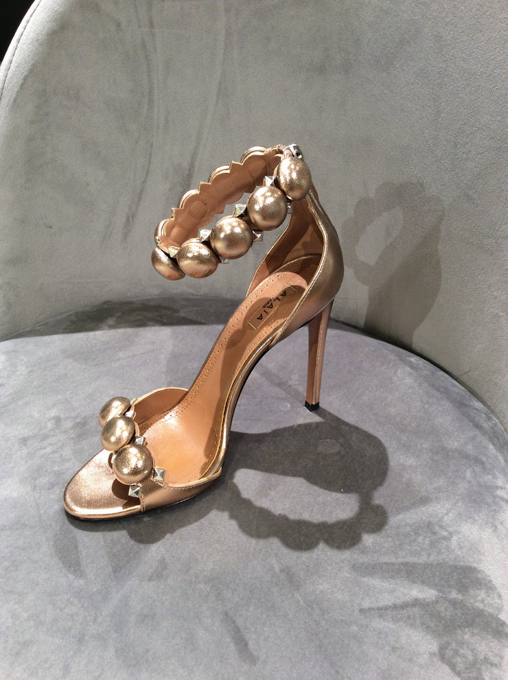 alaia gold sandals