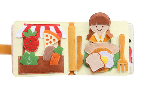 Habi Kids, Mini Quiet Book My Home, vegetables, girl figure at the dining table, food and cutlery on the table