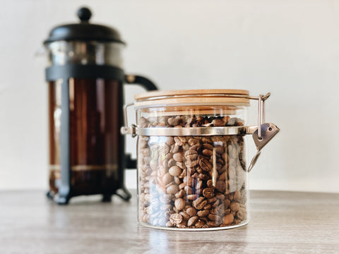 glass coffee bean storage on kitchen counter