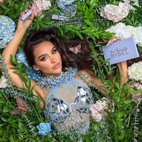 Carli Bybel shines in Blini's light blue dress with lovely mirrors and beads.