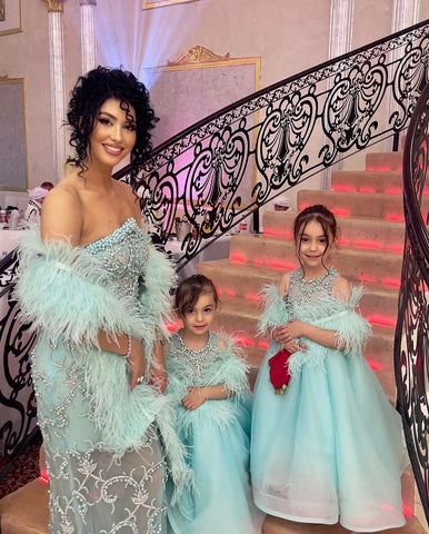 Vjosa Muriqi and her daughters elegantly adorned in matching aqua dresses by Blini