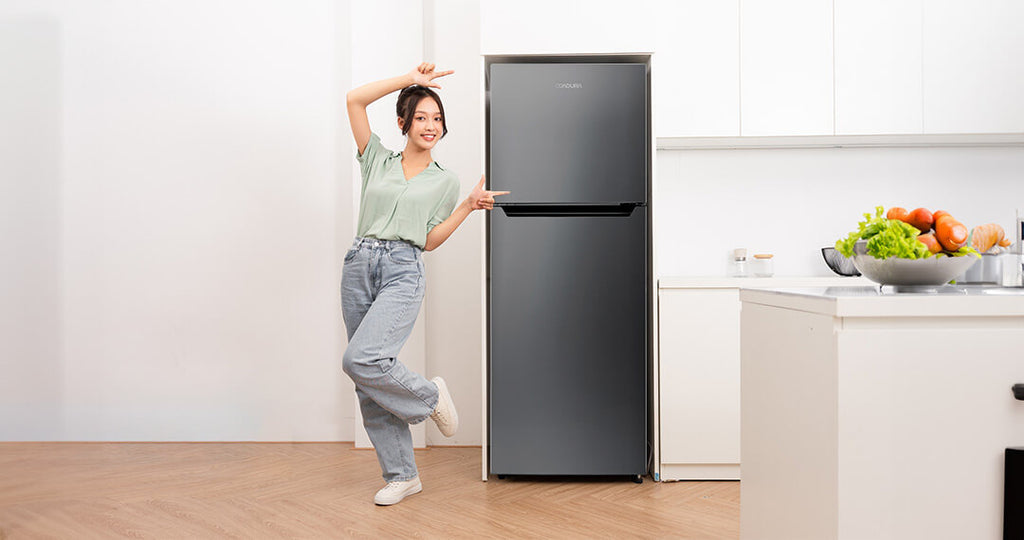 refrigerator-with-a-woman-beside-it