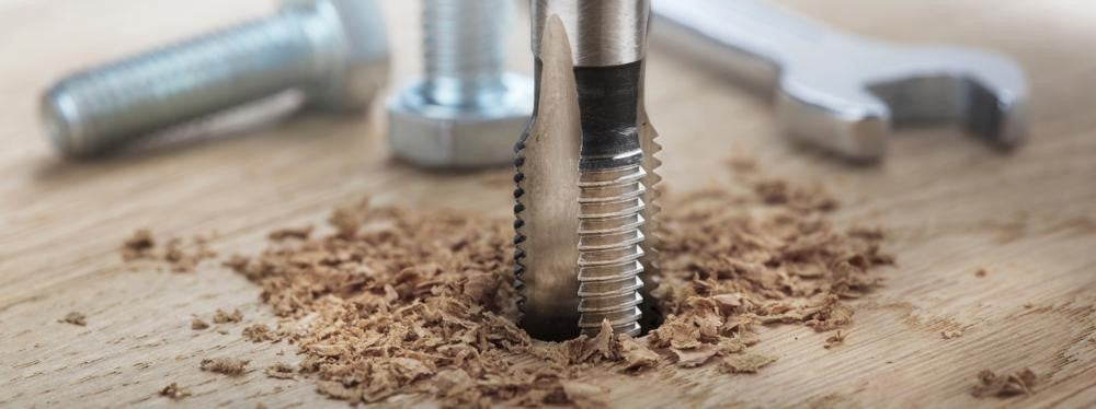 Threaded tap drilling into wood