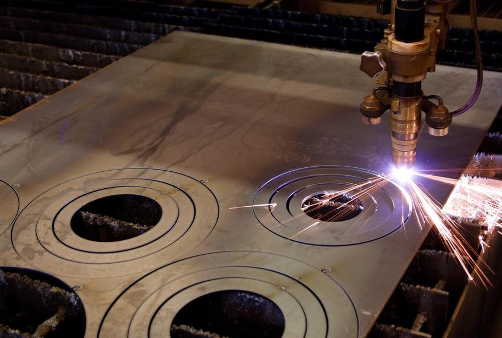 plasma cutting circles out of sheet of metal