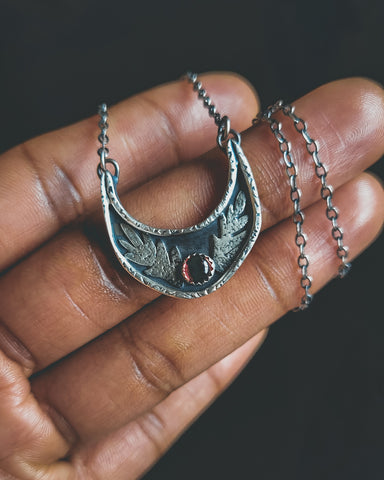 Sterling silver crescent moon necklace set with garnet, January birthstone