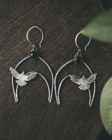 Sterling silver handmade bird earrings set with black onyx