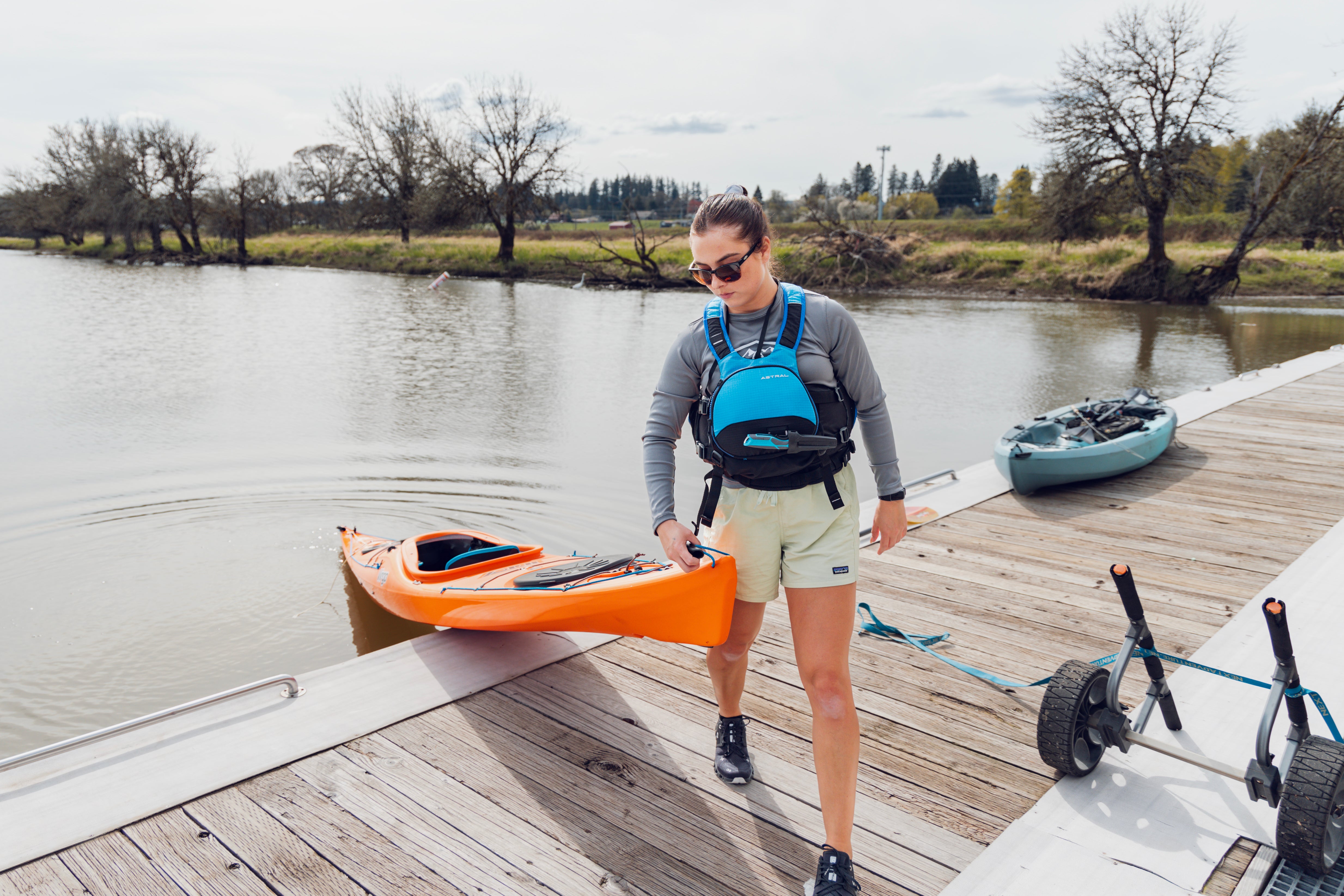 woman on dock with kayak