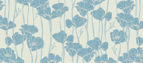 A repeating pattern of blue poppies against an offwhite background