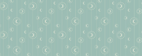 A repeating pattern of white moons hanging by string against light green background