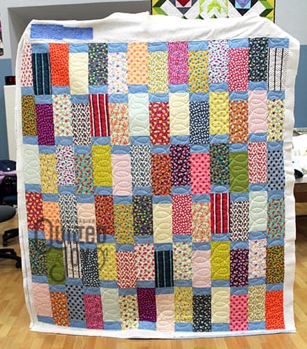 Erin's Long Block Quilt, quilted on a longarm quilting machine at Quilted Joy