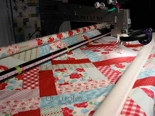 Stripey dotted roses quilt, quilted by Angela Huffman