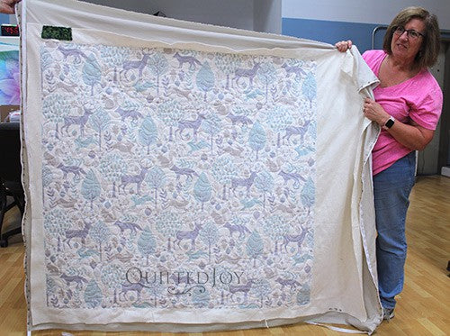 Judy's simple whole cloth quilt after longarm quilting at Quilted Joy