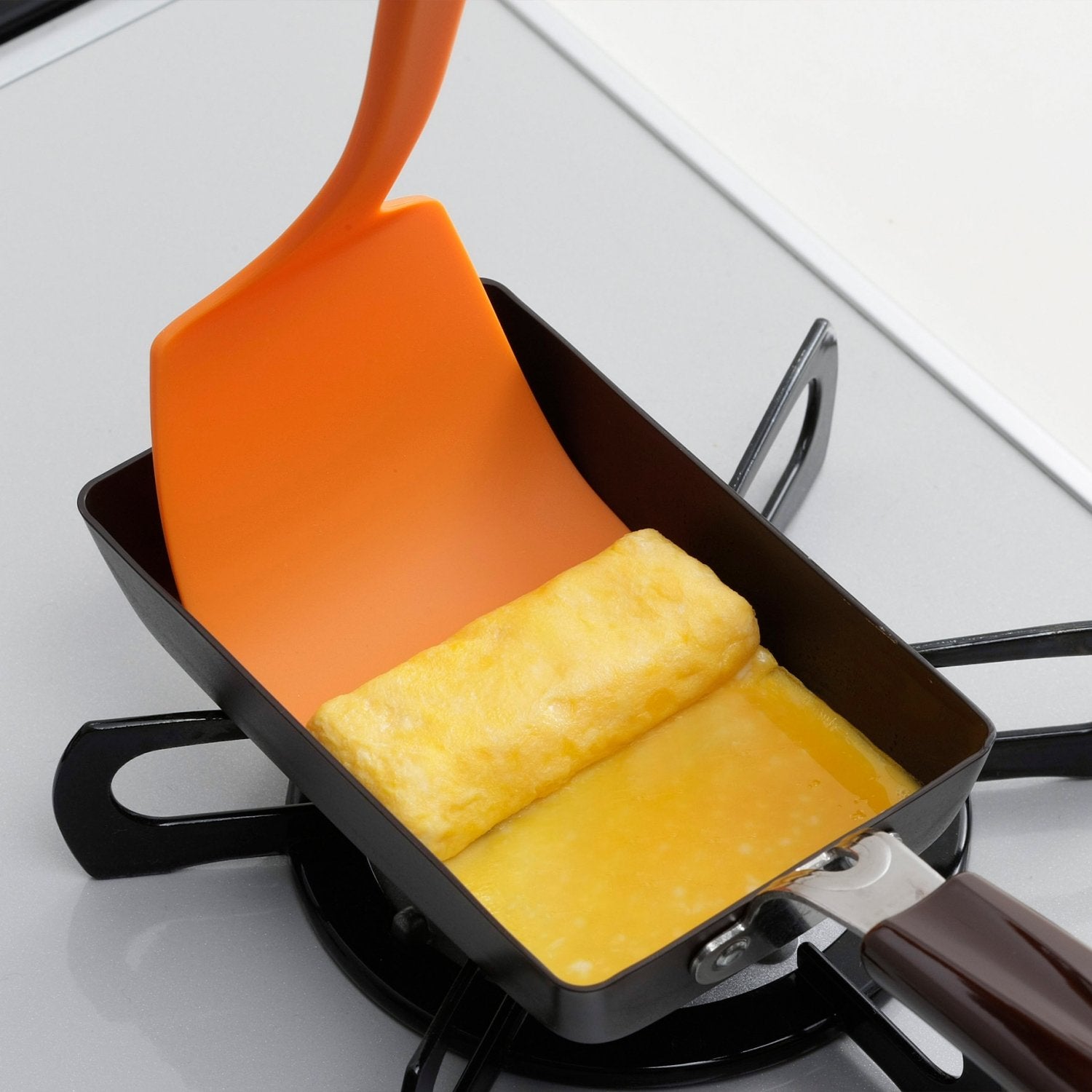 https://cdn.shopify.com/s/files/1/0695/5712/5440/files/P-2-SHMO-FLXSPA-31514-Shimomura_20Heat-Resistant_20Flexible_20Kitchen_20Spatula_20Nylon_20Turner_20Orange-2023-09-14T02_3A47_3A29.jpg?v=1696492742