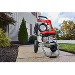 CRAFTSMAN 2800 Pressure Washer sitting on sidewalk with home in background