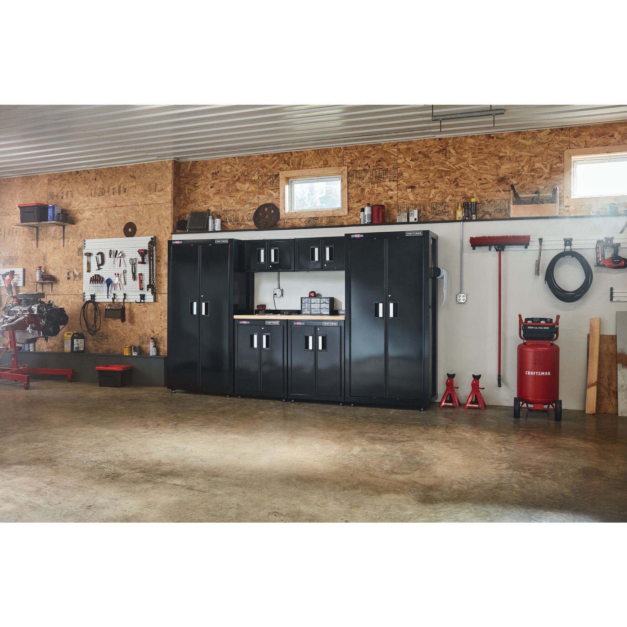 126 inch wide 7 Piece Welded Metal Storage Suite With Cabinet Storage containing tools placed in a large workshop along with a variety of other tools and equipment.