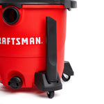 Front facing of CRAFTSMAN 1-7/8 in. Crevice Tool attached to Caster foot storage on wet/dry vac