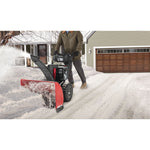 30 inch 357 CC electric start two stage snow blower being used.