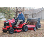 42 inch high speed lawn sweeper being used to clean yard.