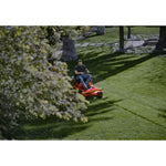 Top view of 22 h p 46 inch zero turn riding mower being used by a person to mow the lawn.