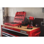 Half inch drive brushless cordless impact wrench placed of craftsman tool table.