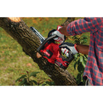 12 inch cordless compact chainsaw kit 4 amp hour being used for cutting tree.