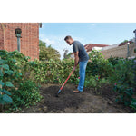 Fiberglass handle garden hoe being used by a person.