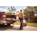 20 volt 7 inch cordless compact wet tile saw being carried by a person outdoors.