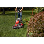 CRAFTSMAN M255 Self-Propelled Lawn Mower in front view mowing lawn in gray shirt and jeans