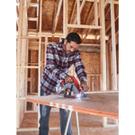 20 volt 7 1 quarter inch brushless cordless circular saw being used by a person to cut wood.