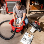 Man replacing the dust collection bag inside a CRAFTSMAN 16 Gallon 6.5 Peak HP Wet/Dry Vac