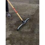 24 inch dual-blade floor squeegee cleaning water on garage floor