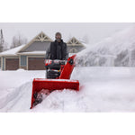 CRAFTSMAN Performance 30 Snowblower clearing snow from driveway gray house in background