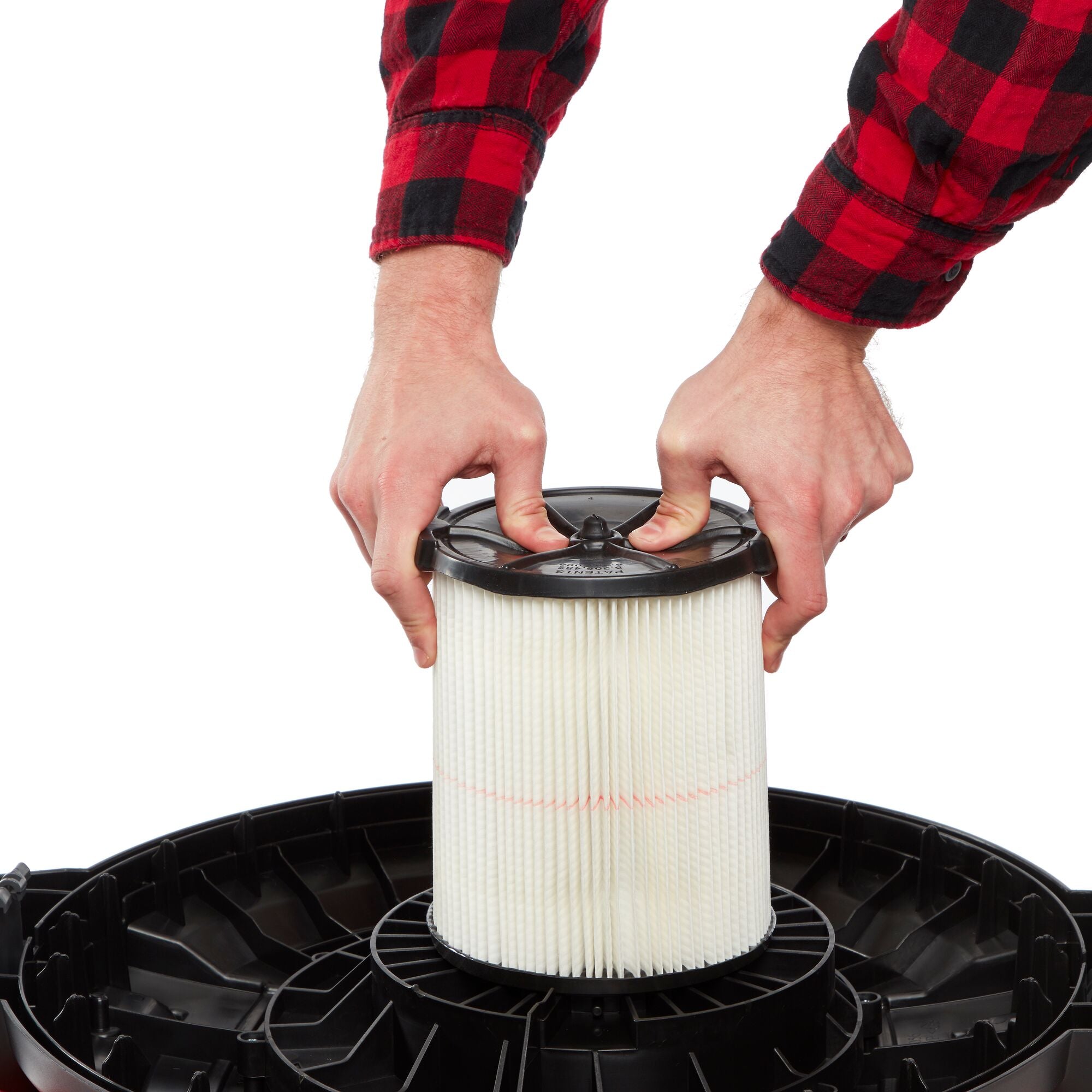 Person installing CRAFTSMAN General Dirt Replacement Filter onto wet/dry shop vac powerhead